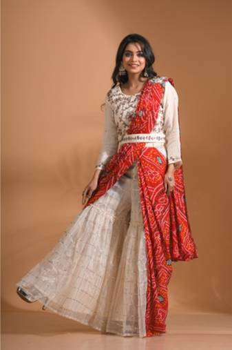 Cream sharara set attached with dupatta with hand embroidery