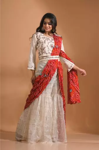 Cream sharara set attached with dupatta with hand embroidery