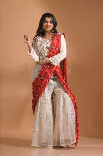 Cream sharara set attached with dupatta with hand embroidery