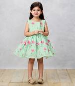 Floral printed green dress with contrasting back bow