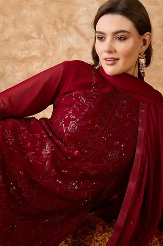 Women's semi stitched pakistani suit in maroon georgette with designer embroidery and dupatta