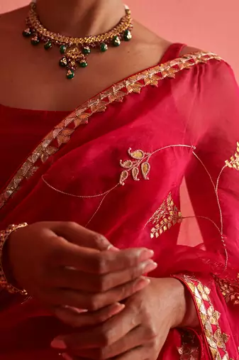 Red and pink hand embrodiered saree with mashru silk blouse