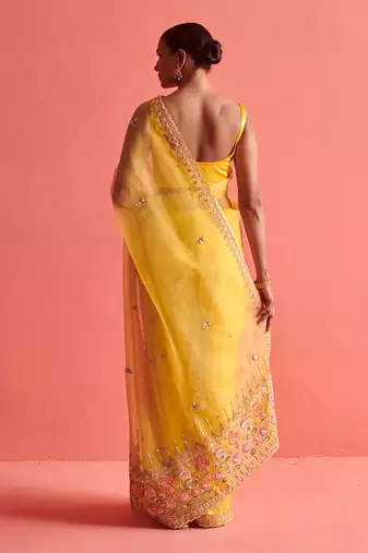 Yellow hand embrodiered saree with mashru silk blouse