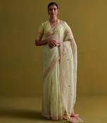 Sage green hand embrodiered saree with raw silk blouse
