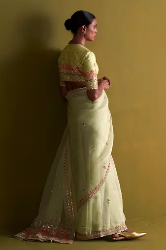 Sage green hand embrodiered saree with raw silk blouse