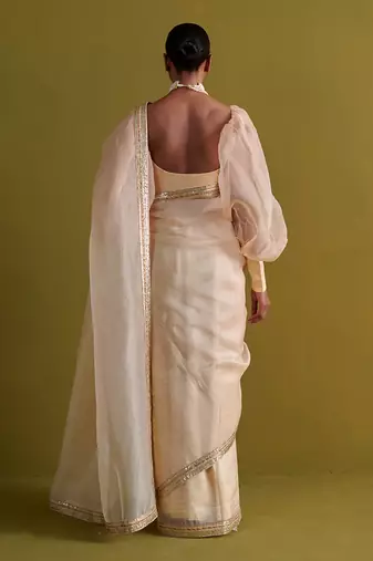 Beige hand embrodiered saree with raw silk blouse