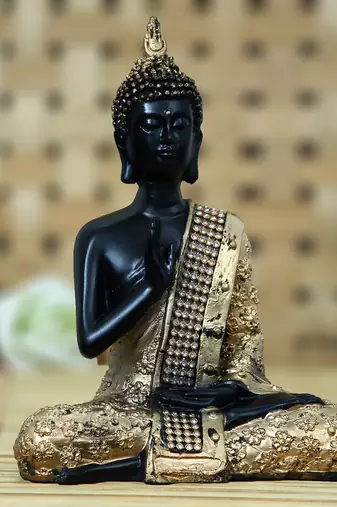 One handcrafted meditating blessing buddha