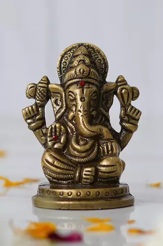 One metal handcrafted golden blessing lord ganesha idol