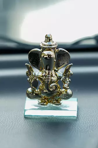 One golden lord ganesha crystal statue for home and car dashboard