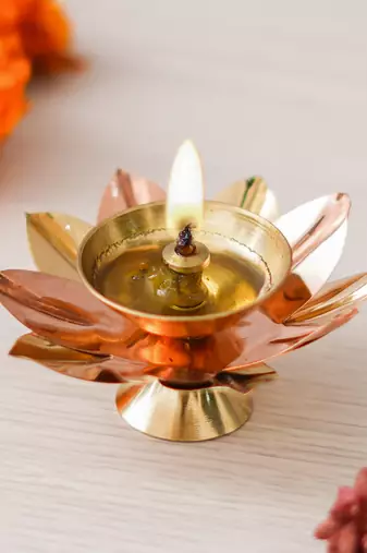 One copper and golden lotus flower shape decorative brass diya