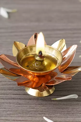 One copper and golden lotus flower shape decorative brass diya