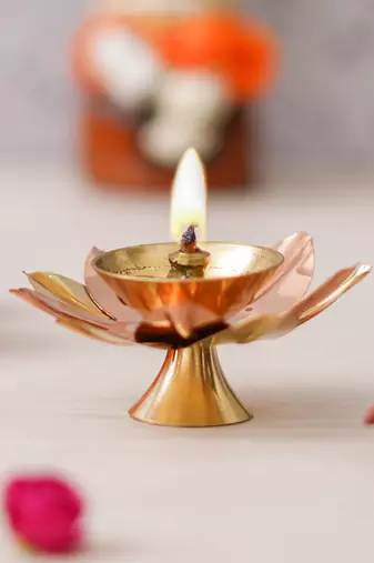 One copper and golden lotus flower shape decorative brass diya