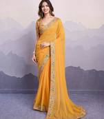 Glamorous yellow embroidered georgette indian designer saree for weddings parties and traditional occasions