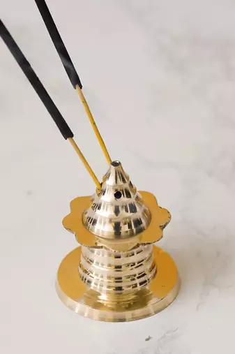 One traditional golden brass incense stick holder agarbatti stand