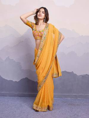 Glamorous yellow embroidered georgette indian designer saree for weddings parties and traditional occasions 4