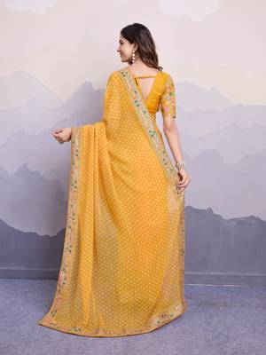 Glamorous yellow embroidered georgette indian designer saree for weddings parties and traditional occasions 5