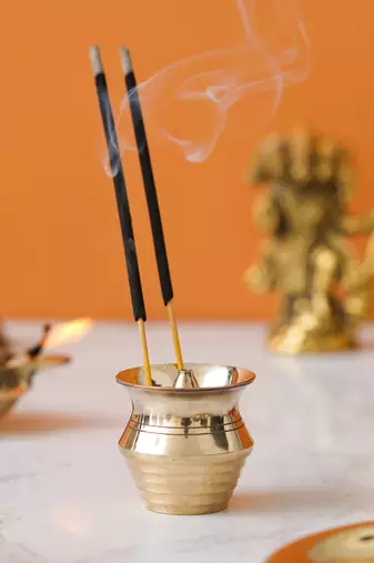 One golden matka shape brass incense stick holder agarbatti stand
