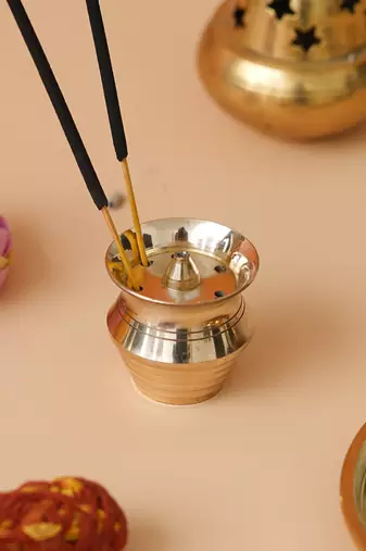 One golden matka shape brass incense stick holder agarbatti stand