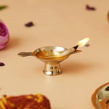 One golden decorative brass diya with stand and holder 1