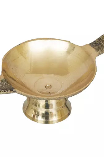 One golden decorative brass diya with stand and holder