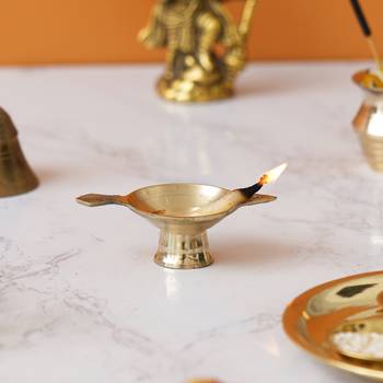 One golden decorative brass diya with stand and holder 4