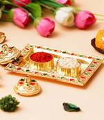 One golden decorative roli chawal holder, akshata haldi kumkum holder
