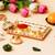 One golden decorative roli chawal holder, akshata haldi kumkum holder