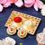 One golden decorative roli chawal holder, akshata haldi kumkum holder