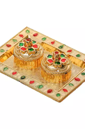 One golden decorative roli chawal holder, akshata haldi kumkum holder