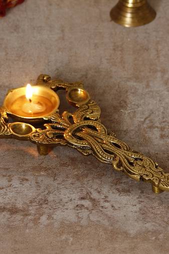 One ethnic carved 7.5 inch brass diya for pooja room and temples
