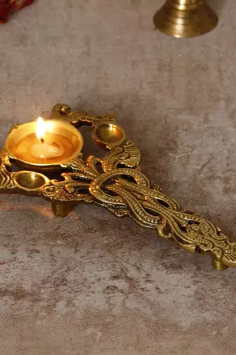 One ethnic carved 7.5 inch brass diya for pooja room and temples