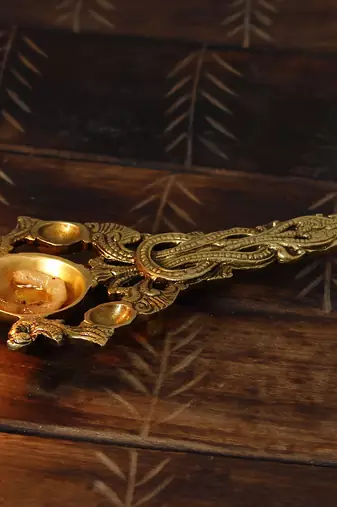 One ethnic carved 7.5 inch brass diya for pooja room and temples
