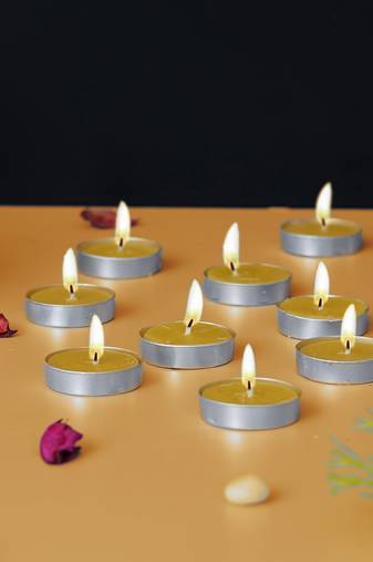 One set of 10 lemon scented tea light candles