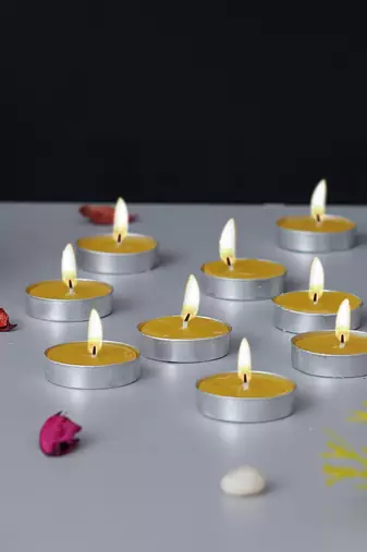 One set of 10 lemon scented tea light candles