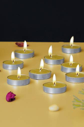 One set of 10 vanilla scented tea light candles
