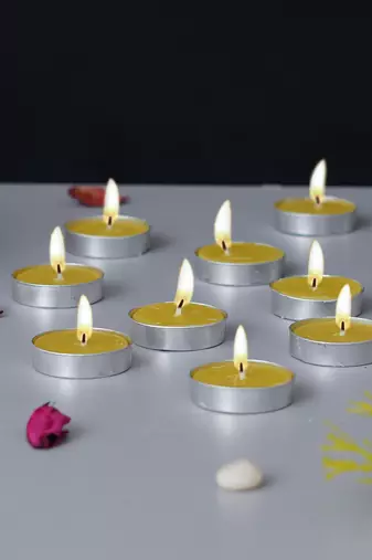 One set of 10 vanilla scented tea light candles