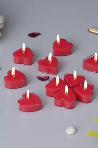 One set of 10 heart shaped rose scented tea light candles