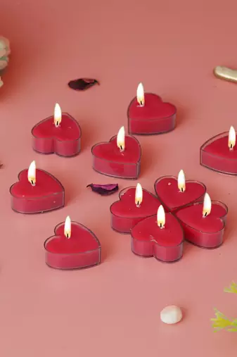 One set of 10 heart shaped rose scented tea light candles