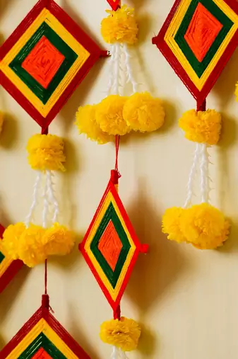 Pack of 10 artificial marigold flowers with colorful woolen kite hangings