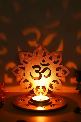 One golden mdf wooden om shadow decorative tea light candle holder diya stand