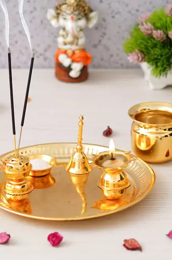 One golden pooja thali set with diya, ghanti, kalash, spoon, agarbatti stand, bowl