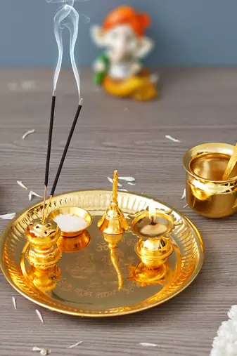 One golden pooja thali set with diya, ghanti, kalash, spoon, agarbatti stand, bowl