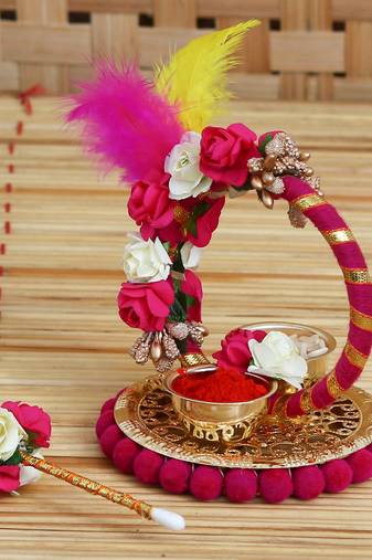 One handcrafted decorative roli tikka holder with designer stick and colorful feathers