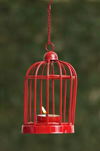 One red iron cage shaped tea light candle holder with hanging chain