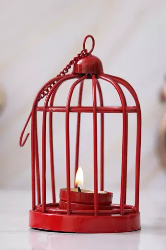 One red iron cage shaped tea light candle holder with hanging chain