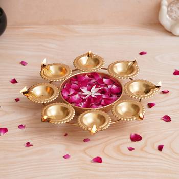One golden handcrafted designer urli with 8 diyas 1