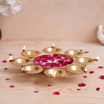 One golden handcrafted designer urli with 8 diyas 2