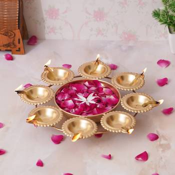 One golden handcrafted designer urli with 8 diyas 4