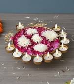 One golden metal traditional peacock designer urli with 11 tea light holders