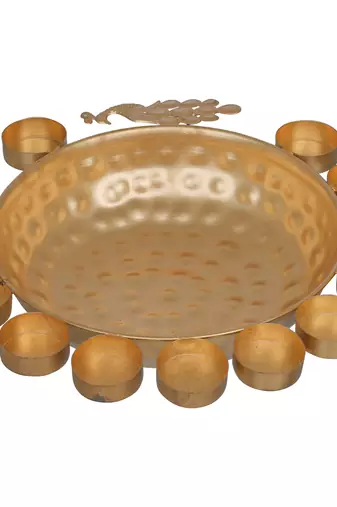 One golden metal traditional peacock designer urli with 11 tea light holders